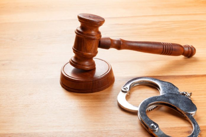 gavel-handcuffs-wooden-table_93675-27090-696x463-3286062